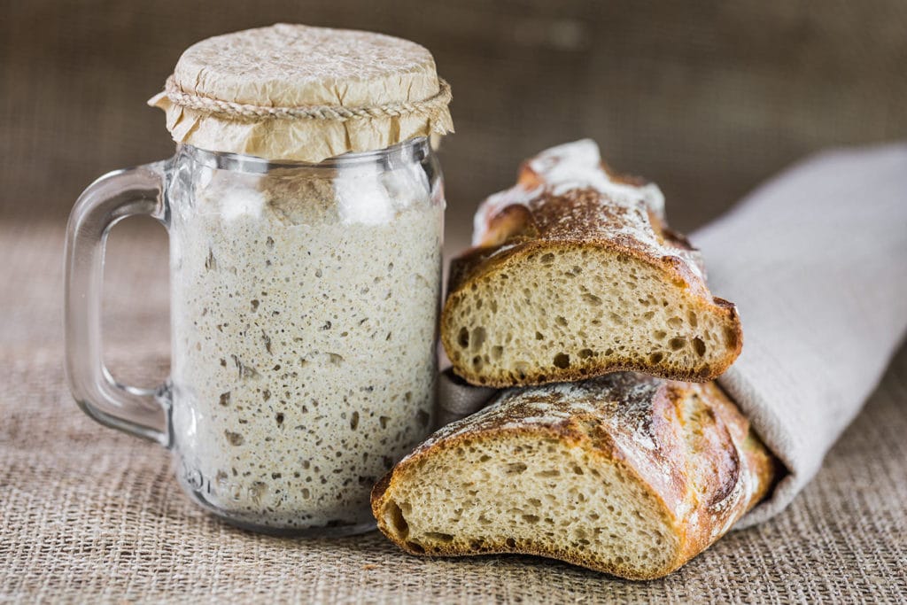 Lidded Jar with Sourdough Leaven and French Sourdough Baguette